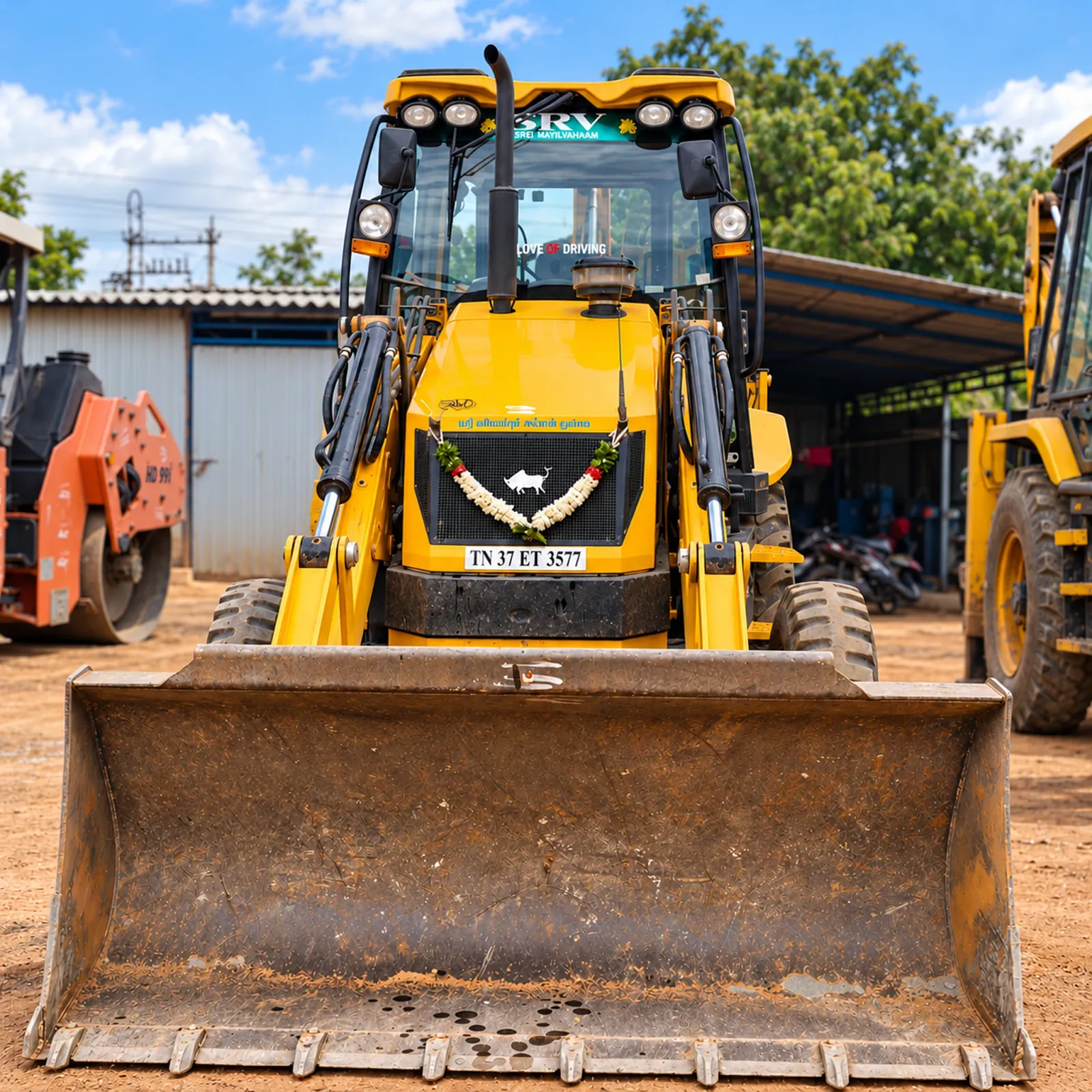 SRV AND CO JCB backhoe loader in the yard
